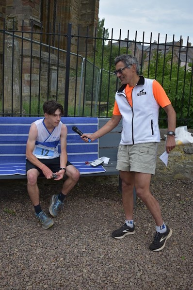 The first WRE
finisher at Jedburgh, Finn Selmer Duguid M16, being interviewed by Planner
Graeme Ackland.  Finn was shadowed round
his course by Kirstin Maxwell as he’s not yet 16. Photo by Stephen Wilson