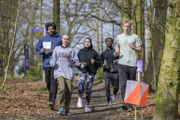 A group of orienteers make their way to a control point