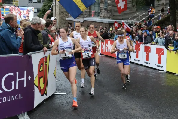 An image taken from the 2024 WOC Knock-out Sprint Finals, Megan Carter-Davies can be seen leading a pack of Athletes